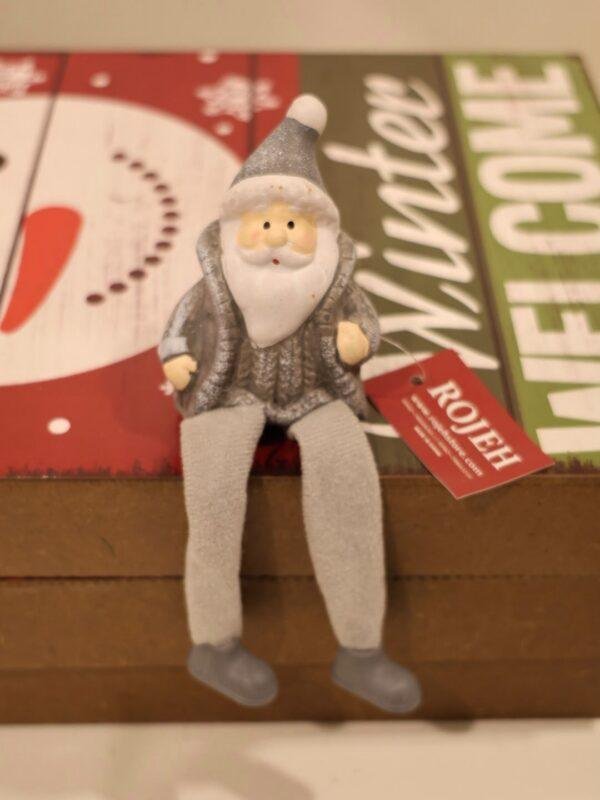 Ceramic santa dangling leg