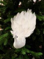 Bring graceful elegance to your Christmas décor with this handcrafted white feather bird ornament. Featuring soft layered feathers and a long flowing tail, it adds movement, texture, and a luxurious touch to your Christmas tree, wreaths, garlands, or festive centerpieces. Its lightweight clip design makes decorating easy while creating a timeless winter look. Features * Handcrafted decorative feather bird * Soft white layered feathers with a long elegant tail * Easy clip attachment for secure placement * Perfect for Christmas trees, wreaths, garlands, and centerpieces * Designed to complement both classic and modern holiday décor
